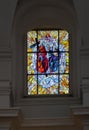CheÃâm, Poland, May 06, 2022: Stained glass window in the window of the church, the shrine of the Mother of God in CheÃâm